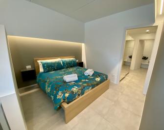 Bedroom with double bed, two wardrobes and reading lights