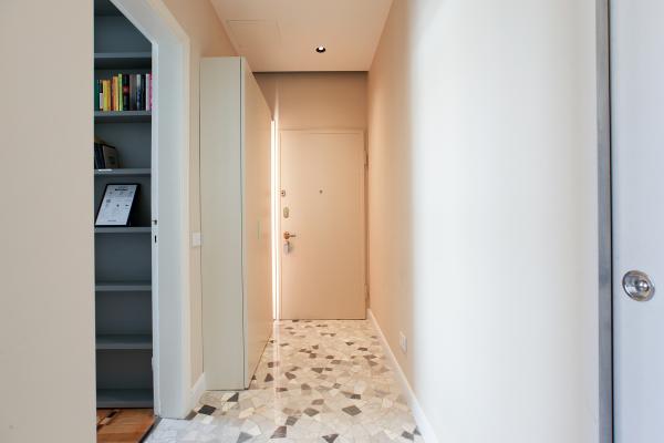 Located in a Rationalist building featuring a grand marble lobby and a vintage mahogany elevator